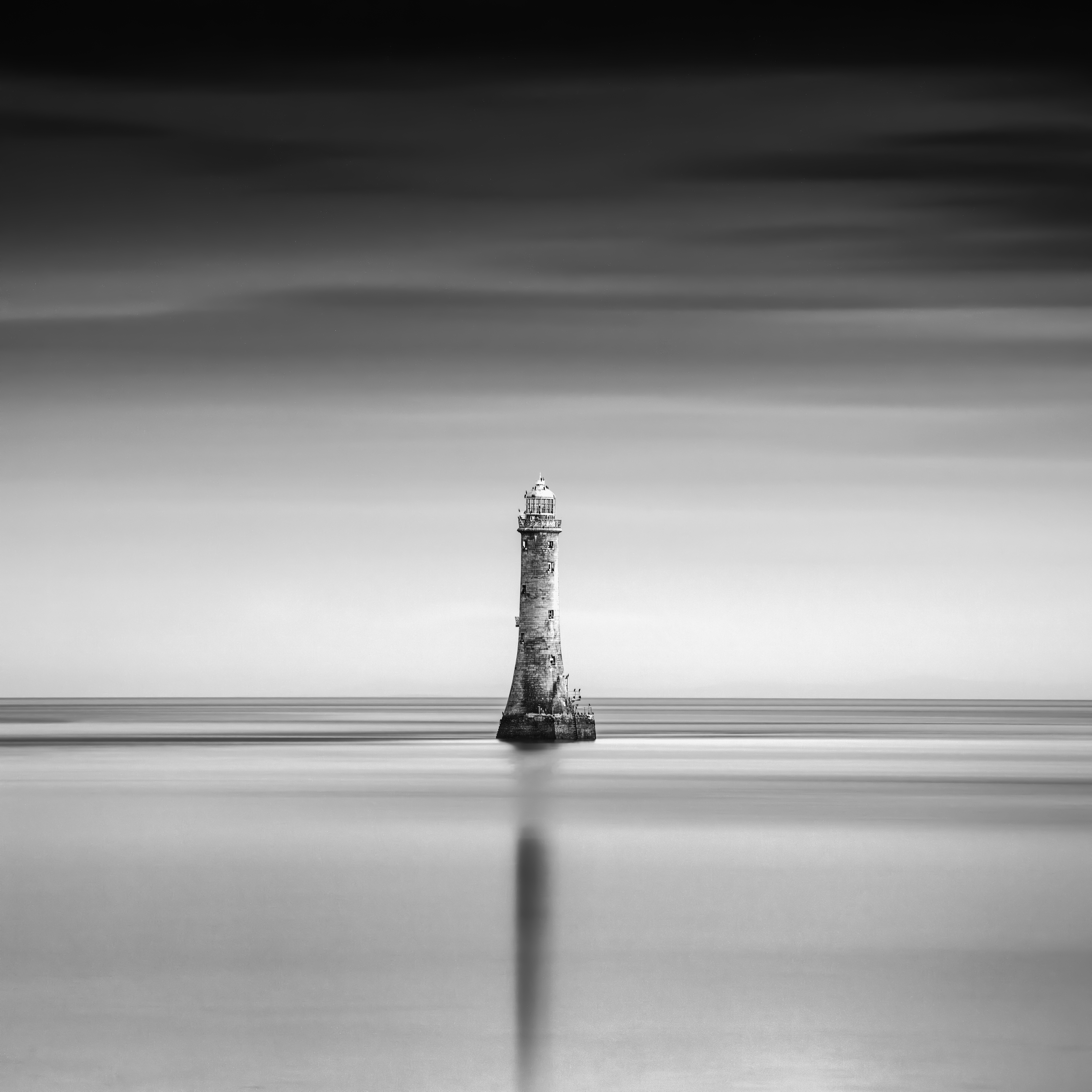 Carlingfords Guiding Light — a solitary lighthouse surrounded by long-exposure sea and sky