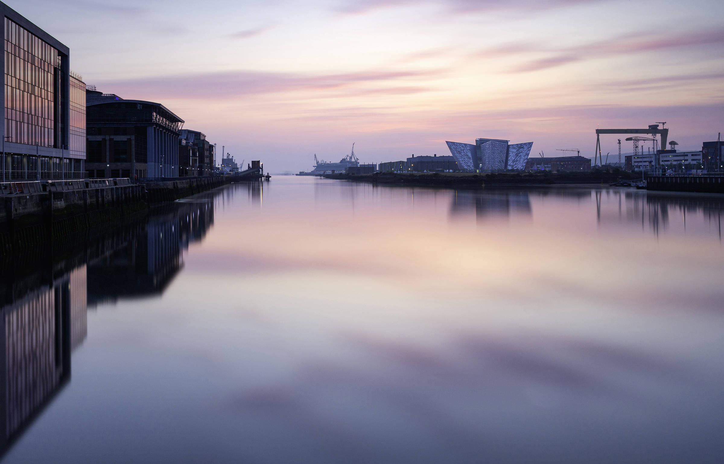 Titanic Belfast — the waterfront and Titanic Belfast held within quiet evening light